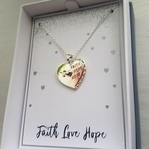 Never worn or taken out of box. Necklace w/heart pendant. Faith. Love. Hope.
